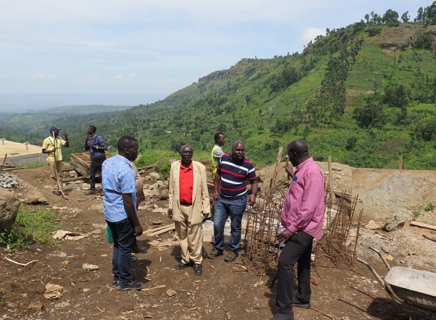 Permanent Secretary, Bulegeni Town Council Mayor,  WSDF-East Manager and his team inspecting progress of work of Bulegeni WSSS.